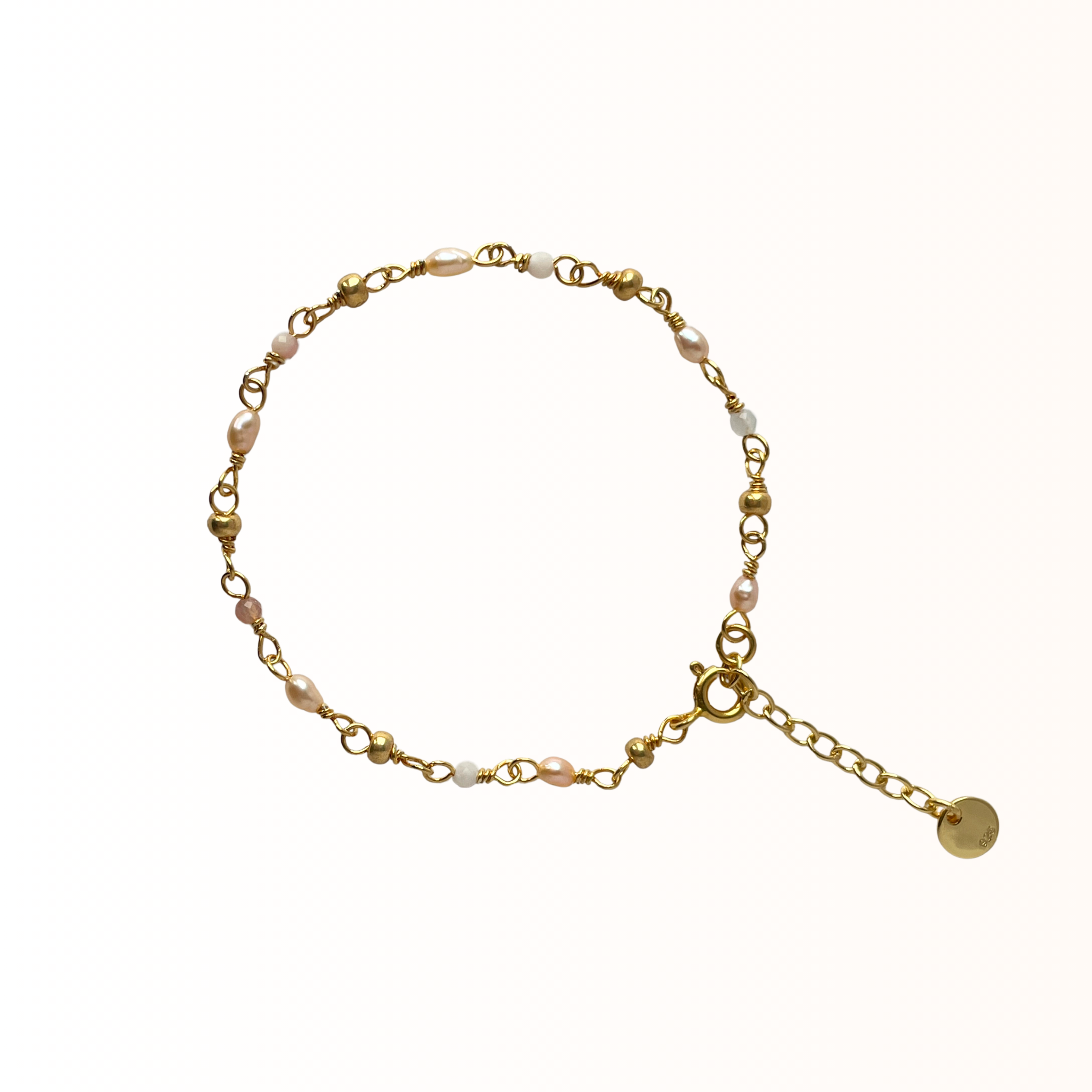 Feminint armbånd med rosa perler